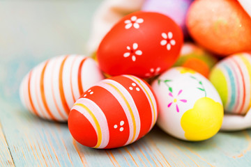 Several colorful Easter eggs in sack close