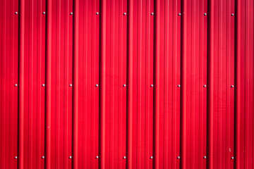 red corrugated tin blank background with rivets.