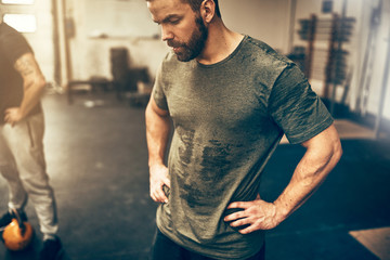 Fit young man sweating after a gym workout session - Powered by Adobe
