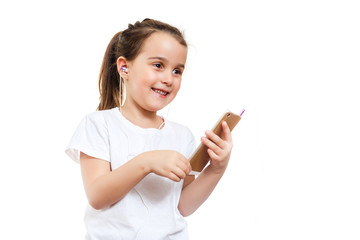 Beautiful little girl using smart phone listen music