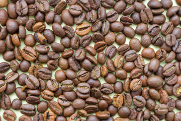 Roasted coffee beans as coffee background. Aroma ingredients.  Natural morning drink. Coffee bean close up. Black coffee. Morning concept. 