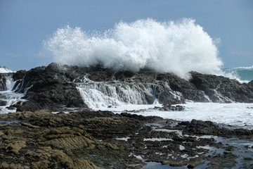 erupting waves at Siung beach Java island, Indonesia - high tide is coming