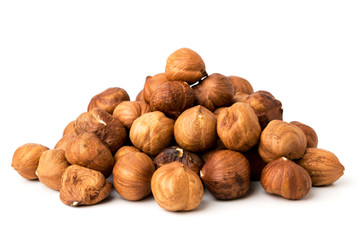 Pile of hazelnuts on white background isolated.