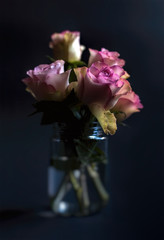 Pink roses in metal basket. Vintage decor concept. Valentine's day concept
