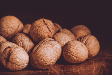 A lot of walnuts lying on the table