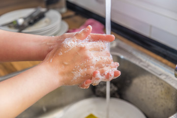 Fototapeta premium woman washing dishes