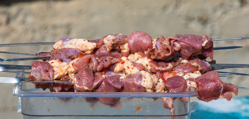 raw meat for barbecue on skewers