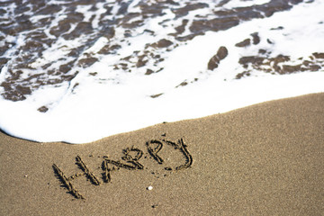  holiday writing concept on sand