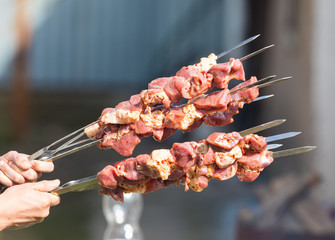 raw meat for barbecue on skewers