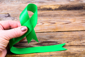 Green ribbon as symbol of awareness of the disease, World Health Day