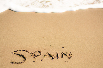 writing on the beach spain