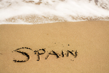 writing on the beach spain