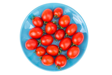 Small fresh tomatoes on plate