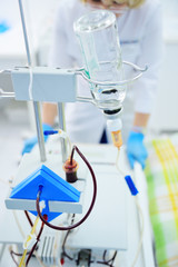 apparatus for blood transfusion on the background of the clinic close-up.