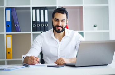 Fototapeta premium Young Business Man Working On Computer In Office.