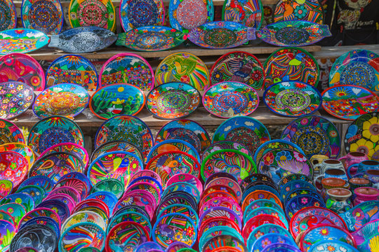 Chichen Itza, Decorative Mexican plates selection on the souvenir stall.