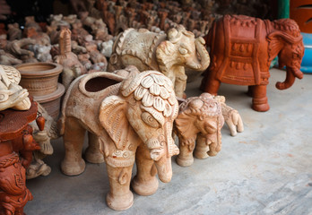 Ceramic White and terracotta elephant figurines for sale as souvenirs in Jodhpur, Rajasthan- India. 