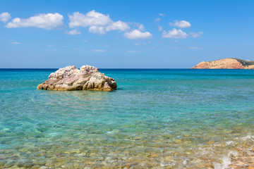 Rocks and blue sea water in summer day. Greece