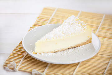 delicious cheesecake with coconut on  plate