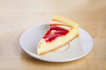 delicious cheesecake with strawberries on  plate