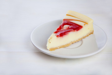delicious cheesecake with strawberries on  plate