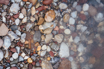 Sea, beach rocks and shore from above. Top view. Beautiful background for summer.