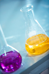laboratory equipment. different glasswares with color liquid in a laboratory