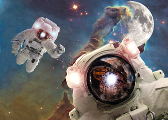 Asrtonauts in the space univese on the pillar of creation background. Elements of this image...