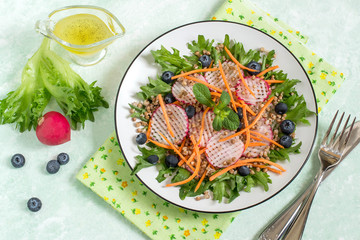 Vitamin vegetarian salad with buckwheat, vegetables and blueberries