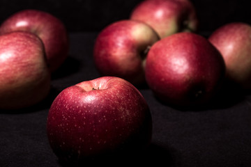 Fototapeta na wymiar red apples on a black background