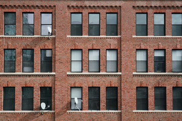 close up on old brick wall building exterior in the city