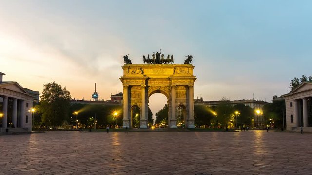 Time lapse of Arco della Pace "Arch of Peace" in Milan , Italy . It is the city gate of Milan located at the center of Simplon Square in Milan , Italy .