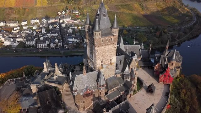Flight over autumn Cochem castle, Mosel valley, Germany