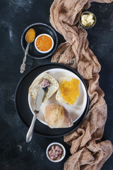 Bright and cozy Breakfast. Toast with butter and jam, pate. Family, happiness, joy, Easter holiday. top view. Close up. Vertical. Selective focus.