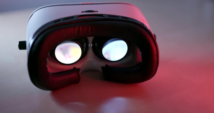 Virtual reality device playing video inside with red light at the back