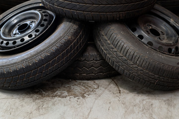 closeup old tire car in the garage with soft-focus and over light in the background
