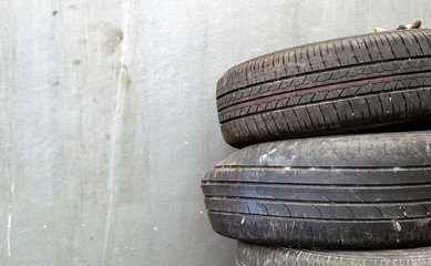 closeup old tire car in the garage with soft-focus and over light in the background