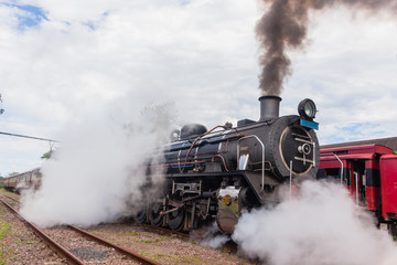 Obraz na płótnie Canvas Steam Train Locomotive Closeup Exhausts Vintage