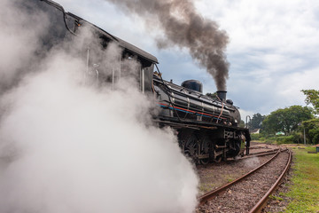 Obraz na płótnie Canvas Steam Train Locomotive Closeup Exhausts Vintage