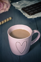 Cup of cocoa on the table, homemade desserts