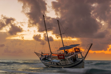 Fishing boat shipwreck or abandoned shipwreck. , Wrecked boat abandoned stand on beach in RHodes