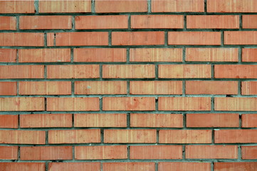 Fototapeta premium Background - Striped bricks. Wall of red bricks.
