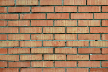 Background - Striped bricks. Wall of red bricks.