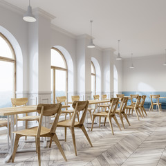 White cafe corner, wooden chairs