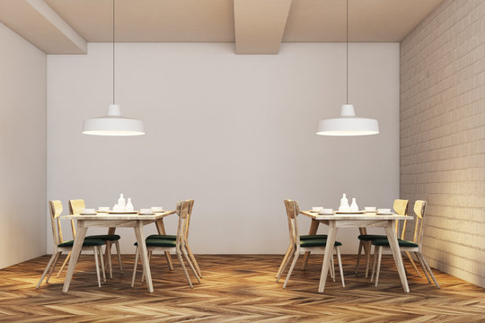 Modern white brick cafe, green chairs