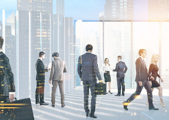 Business people in their office lobby, cityscape