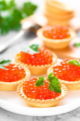 Tartlets with red salmon fish caviar, salmon caviar. Caviar