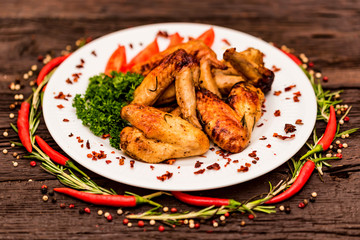 Chicken wings grilled with spices and chili pepper