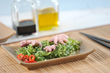 salad of sea kale chukka, octopus, soy sauce - sesame seeds