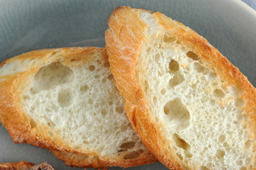 burnt toast is a close-up on blue plate